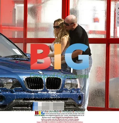 Pregnant actress Charlie Brooks spraying boyfriend