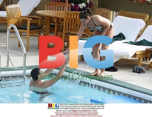 Michelle Heaton and boyfriend relax by pool