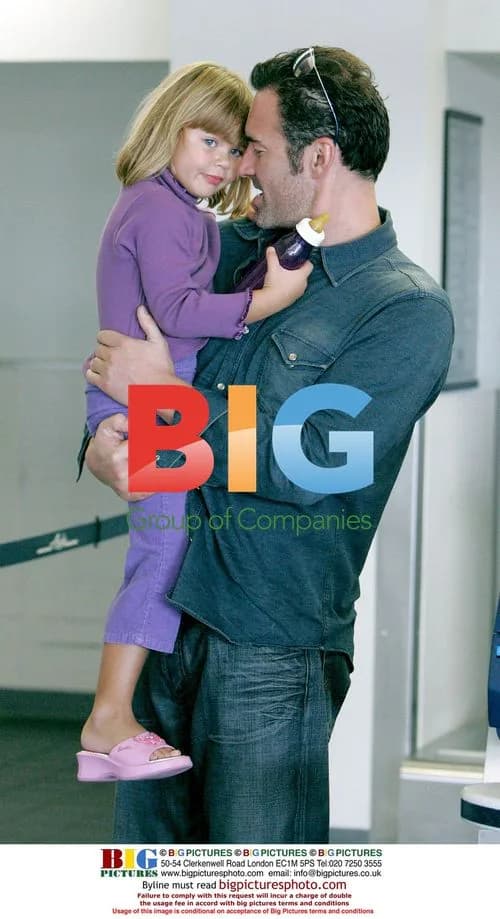 Julian McMahon with daughter at LAX