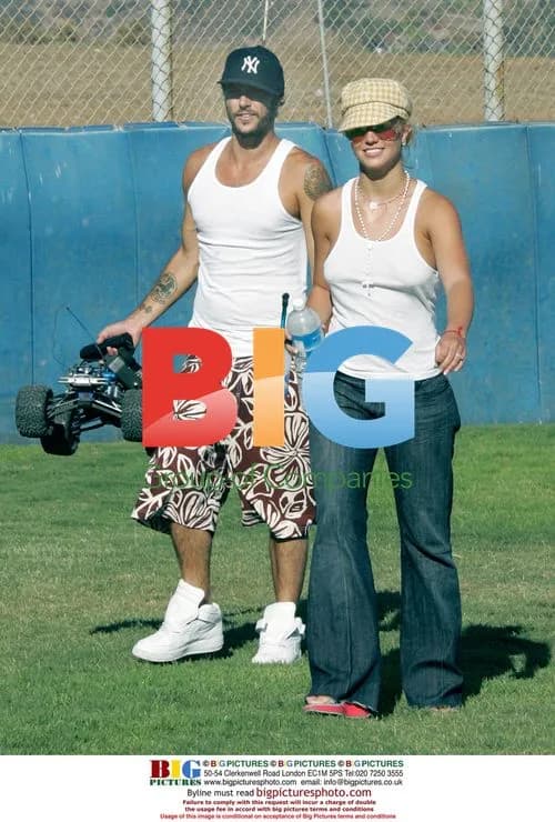 Britney Spears with Kevin Federline playing with remote control cars