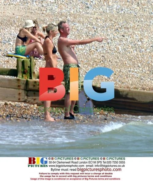 Fatboy Slim and Zoe Ball play in the sea