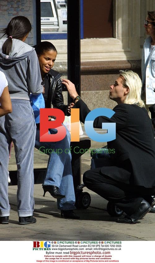 Ms Dynamite and son Shavaar shopping in London