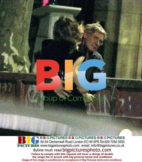 Harrison Ford carries Calista Flockhart