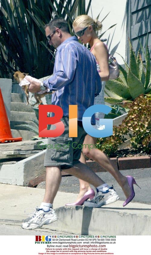 Paris Hilton and dog Tinkerbell leave friend's house