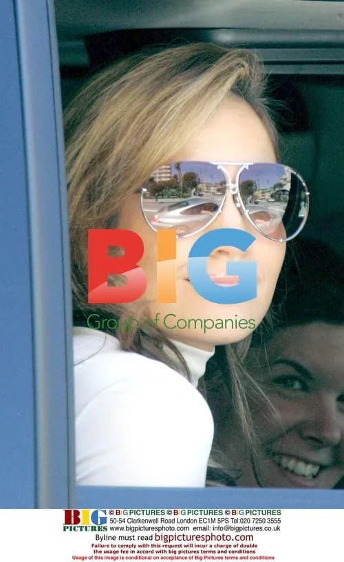 Jennifer Lopez Smiles From Car in Beverly Hills