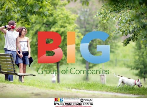 Alex Sibley and Melanie Hill walking dog in park