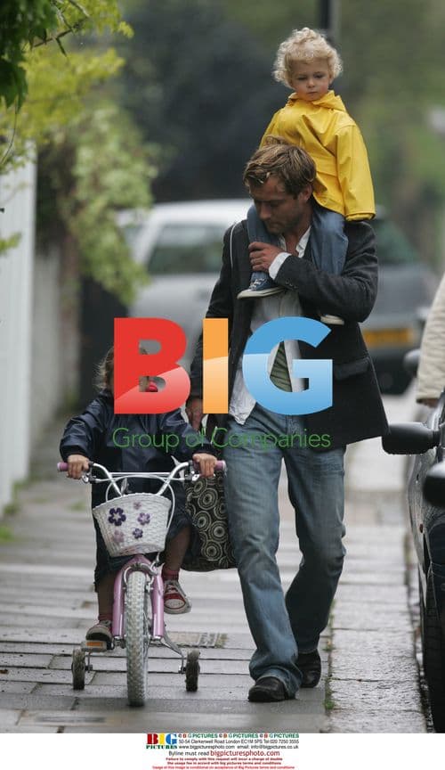 Jude Law with Kids Biking to School
