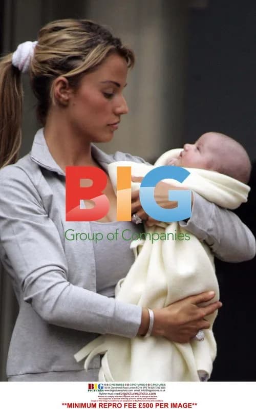 Katie Price leaves Conrad Hotel with Peter Andre and baby