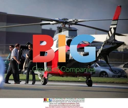 Tom Cruise and Katie Holmes Arrive by Helicopter