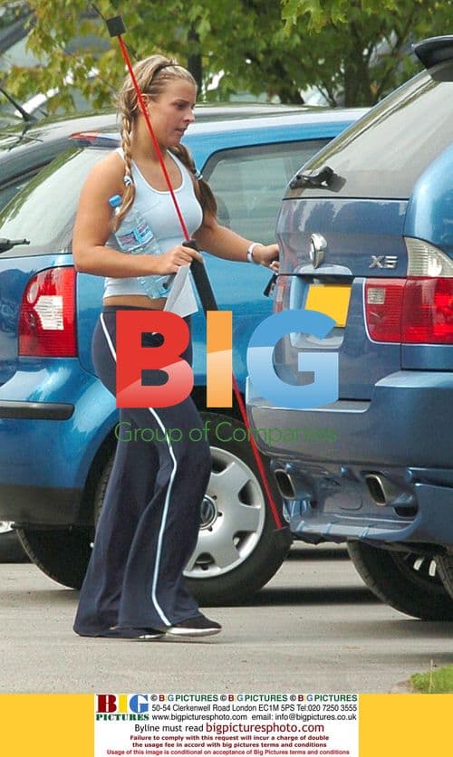 Coleen McLoughlin Carrying Strange Object