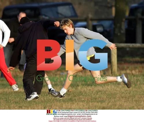Euan Blair plays football with friends