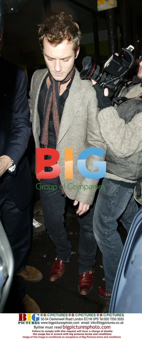Jude Law leaves sister's art show in London