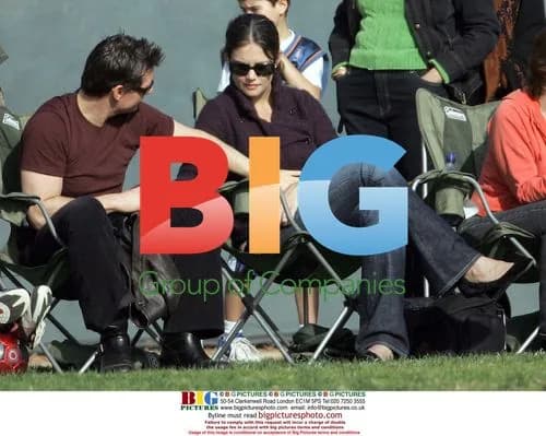 Tom Cruise and Katie Holmes watch daughter's football game