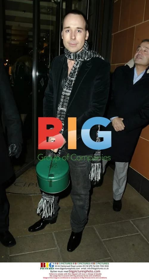 David Furnish leaves Cipriani with cake