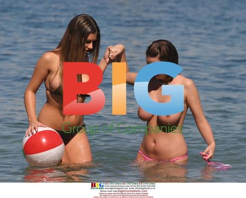 Glamour Models Lucy Pinder and Sophie Howard Playing on Beach