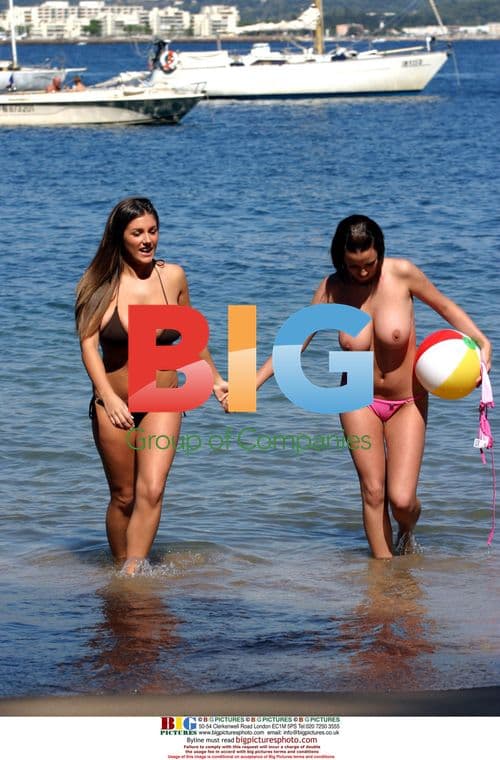 Glamour models Lucy Pinder and Sophie Howard at beach