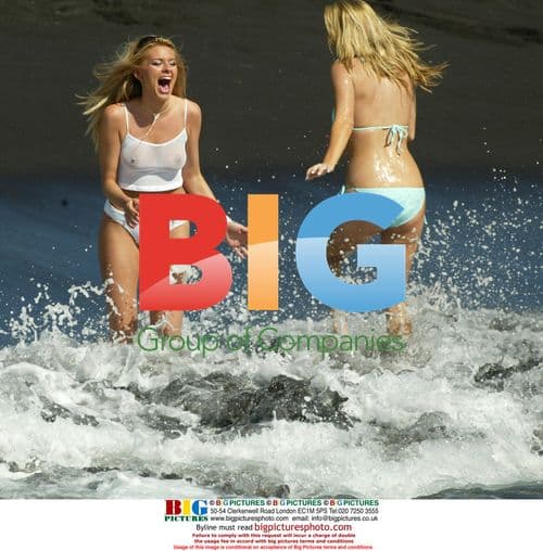 Petta Longstaff and Leah Newman playing in the surf