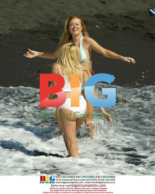 Petta Longstaff and friend Leah Newman play in Tenerife surf