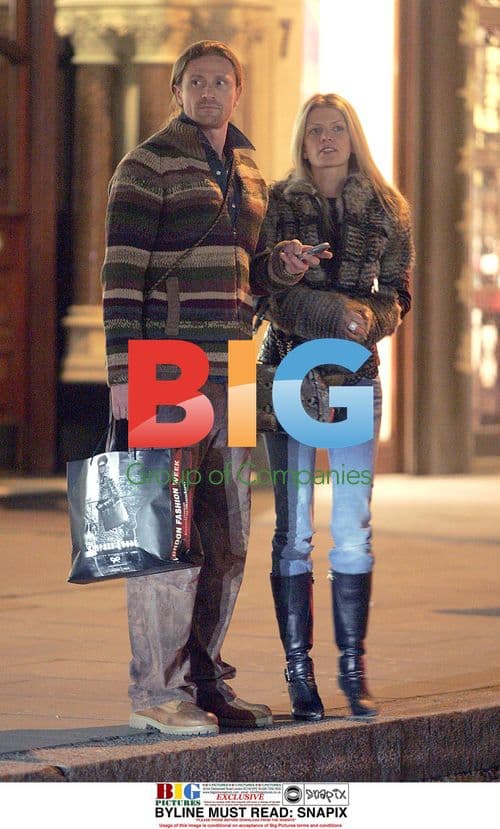 Footballer Emmanuel Petit and girlfriend on London outing