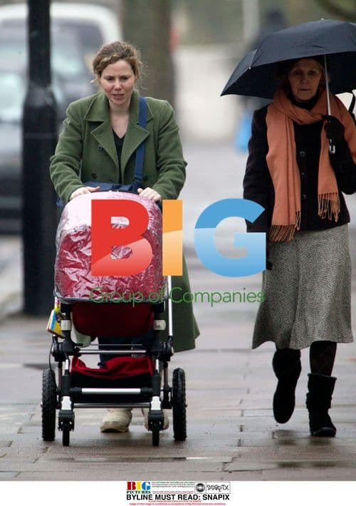 Sally Phillips walking with family in London