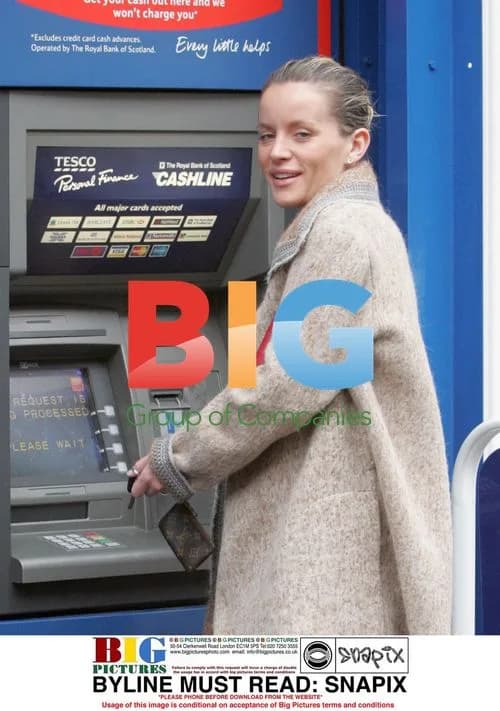 Actress Davinia Murphy flashes cash in London