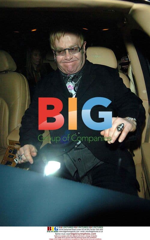 Elton John Exits Restaurant