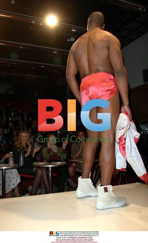 Celebrity in Pink Shorts and Boots