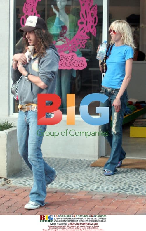 Kimberly Stewart and Cisco Adler with Chihuahua Pup