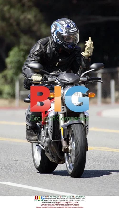 Brad Pitt Stuns Paparazzi on Motorcycle