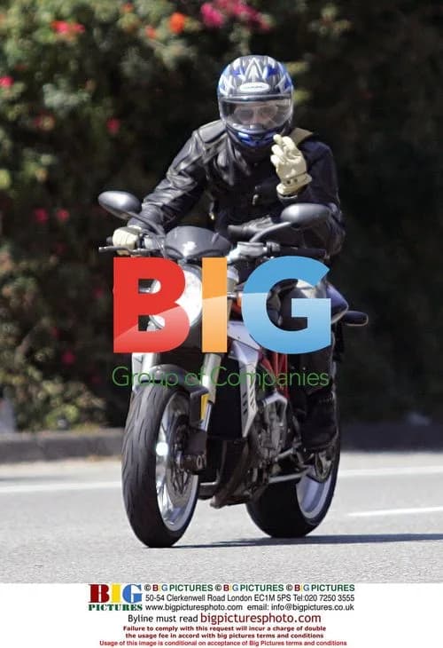 Brad Pitt Flips Off Paparazzi on Motorcycle