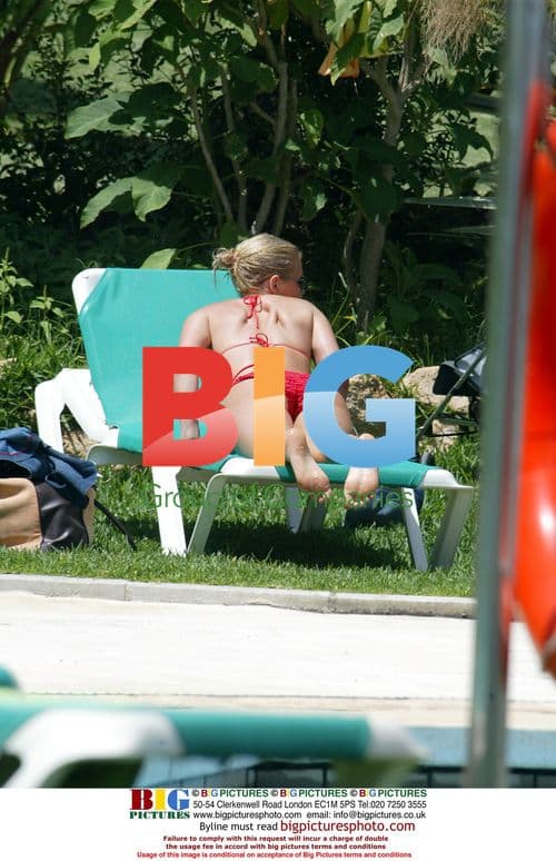 Suzanne Shaw Relaxes by Pool