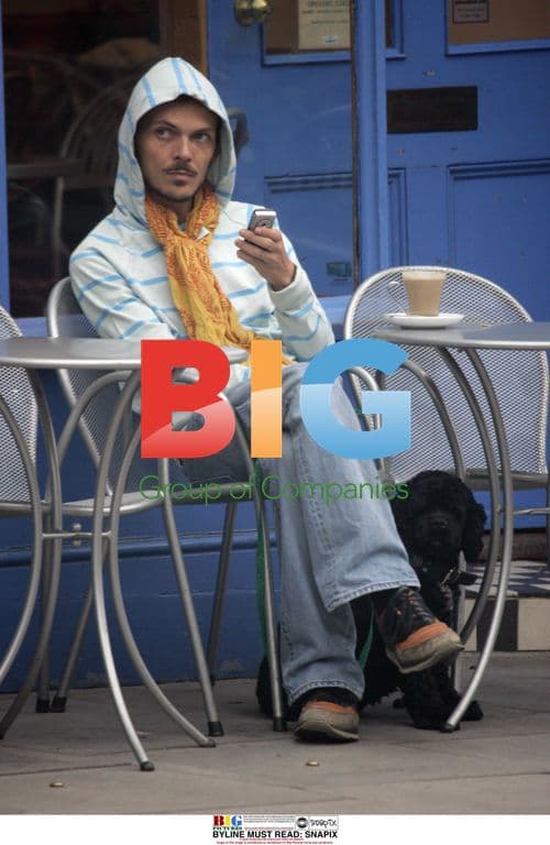 Matthew Williamson outside London cafe