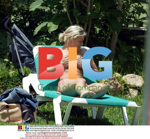 Suzanne Shaw Relaxes by Pool in Grand Canaries