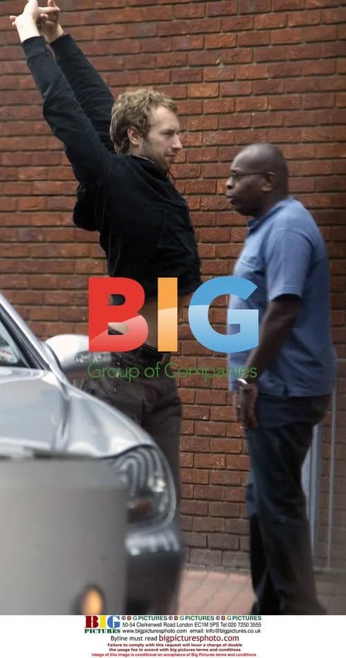 Chris Martin arrives at Heathrow airport