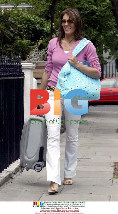 Liz Hurley Arrives Home with Luggage
