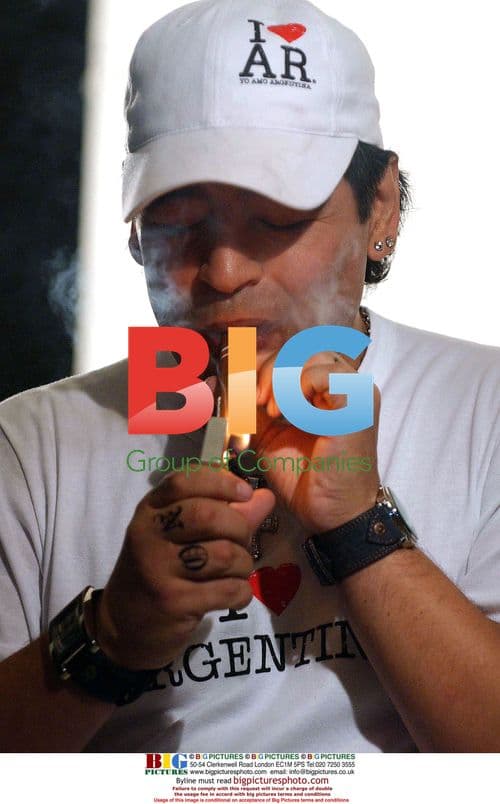 Diego Maradona Poses with Argentina Flag