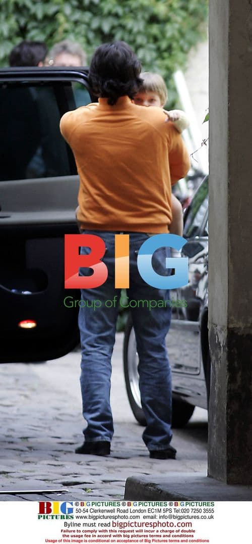 Liz Hurley with husband and son at airport