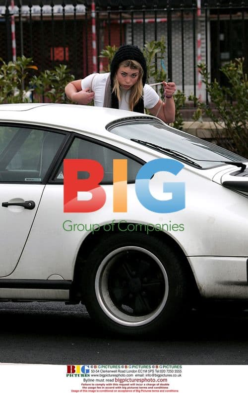 Actress Bill Piper tries to start car