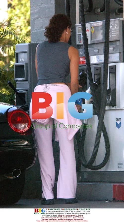 Halle Berry Pumps Gas in Pink Tracksuit