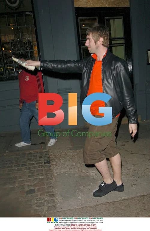Oasis' Liam Gallagher throws beer at photographers