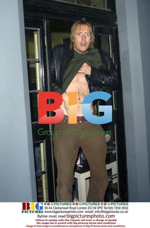 Actor Rhys Ifans leaves pub in disguise