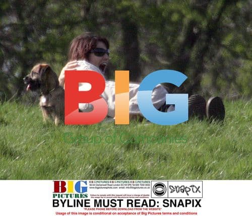 Sarah Parish and boyfriend canoodling in park