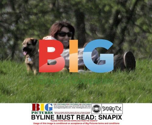 Sarah Parish walks dog with boyfriend in London