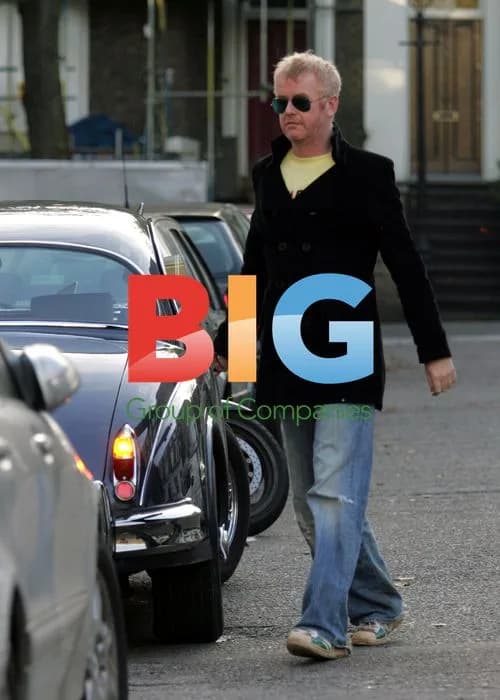 Chris Evans Arrives at Office in Classic Jag