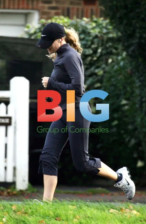 Charlie Brooks in Blue Tracksuit