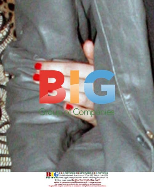 Kimberly Stewart and Talan Torriello Holding Hands