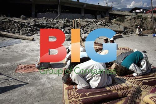 Men Praying at Earthquake Ruins