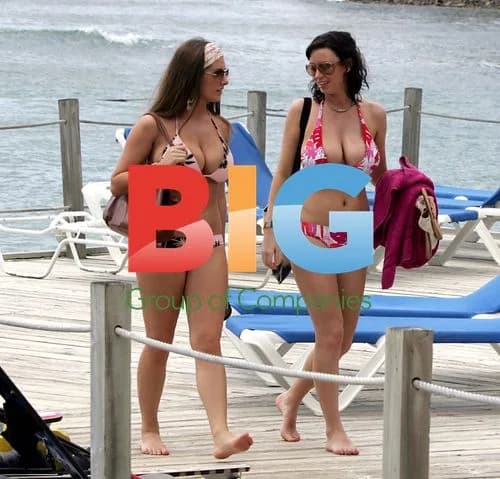Sexy models Lucy Pinder and Sophie Howard cool off in St Lucia