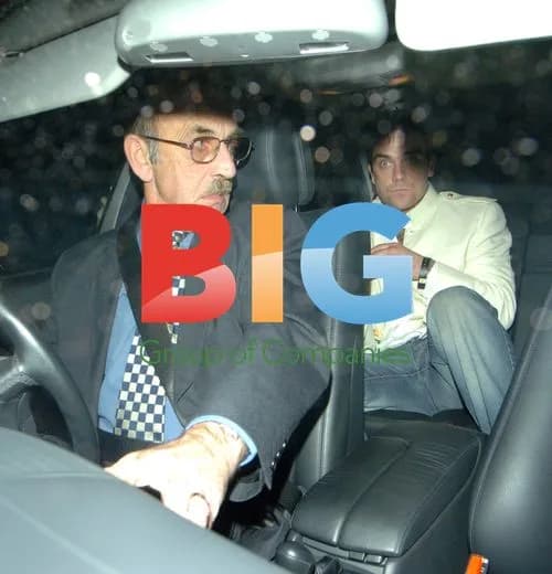 Singer Robbie Williams Leaving Birthday Party