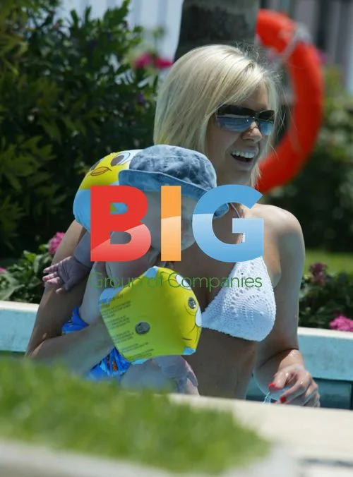 Suzanne Shaw and Child Play in Pool